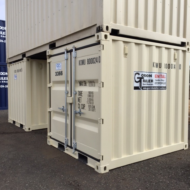 A white container with two doors on the side.